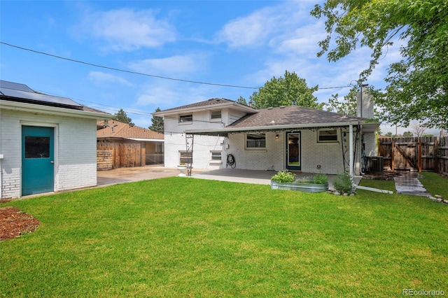 5315 Newland St, Arvada, CO 80002 - back of house featuring brick siding, a gate, cooling unit, and a patio area