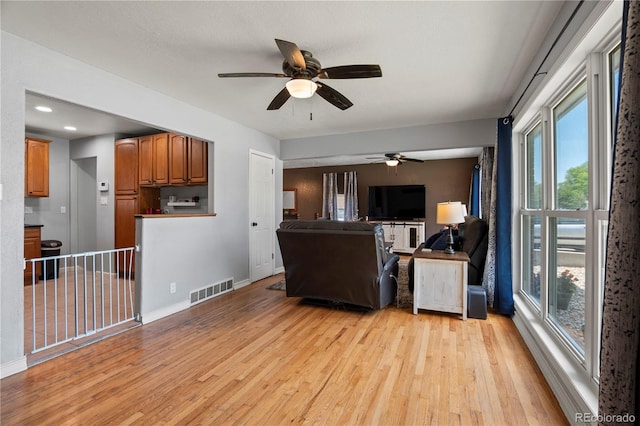 160 Northglenn Dr, Northglenn, CO 80233 - living area featuring a ceiling fan, light wood finished floors, baseboards, and recessed lighting