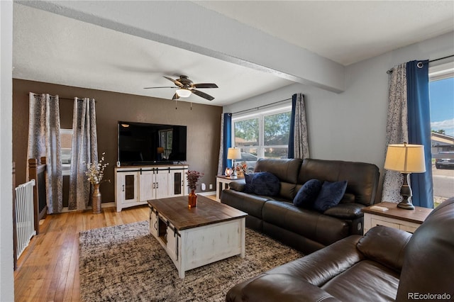 160 Northglenn Dr, Northglenn, CO 80233 - living area with light wood-style flooring, ceiling fan, and baseboards