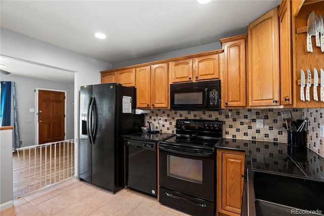 160 Northglenn Dr, Northglenn, CO 80233 - kitchen featuring black appliances, decorative backsplash, light tile patterned flooring, dark countertops, and recessed lighting