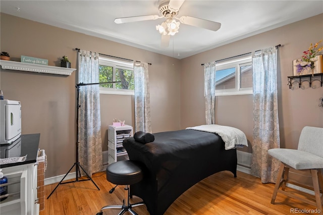 160 Northglenn Dr, Northglenn, CO 80233 - bedroom with light wood finished floors, a ceiling fan, and baseboards