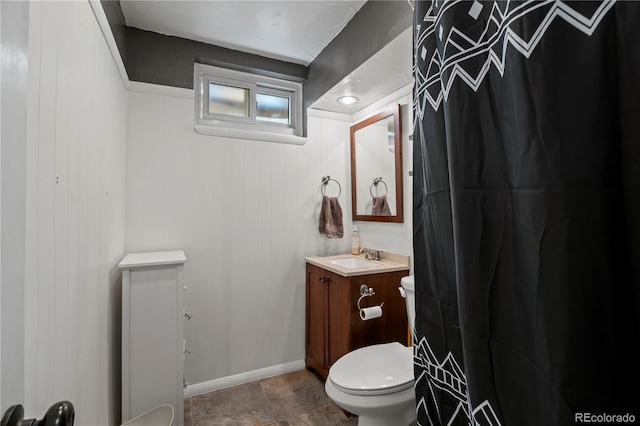 160 Northglenn Dr, Northglenn, CO 80233 - bathroom with toilet, vanity, and baseboards