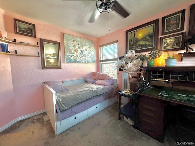 bedroom featuring ceiling fan and light carpet