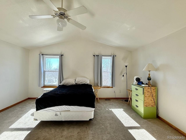 carpeted bedroom with lofted ceiling and ceiling fan