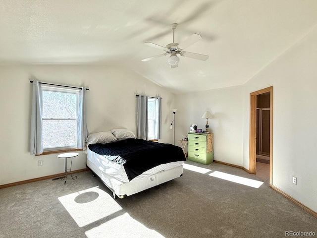 bedroom with ceiling fan, vaulted ceiling, multiple windows, and carpet