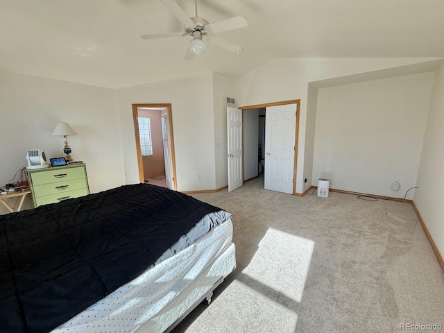 bedroom with lofted ceiling, light colored carpet, and ceiling fan