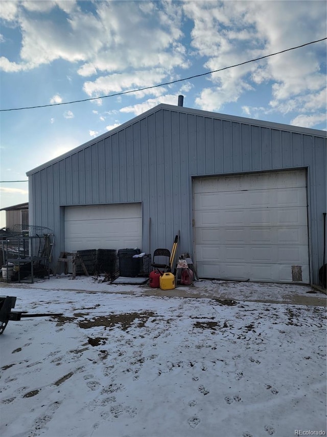 view of snow covered garage