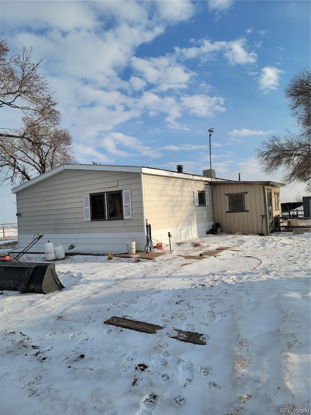 view of snow covered property