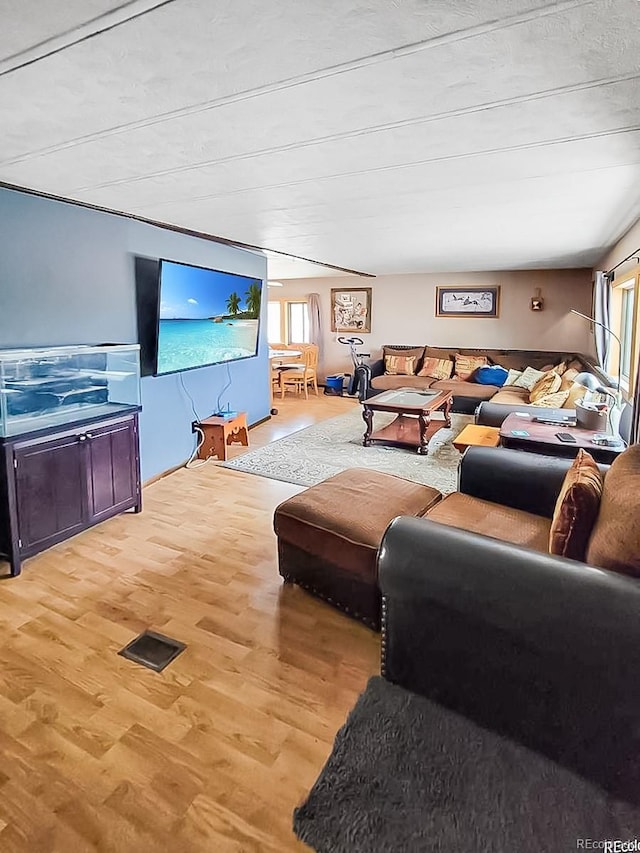 living area with light wood-style floors