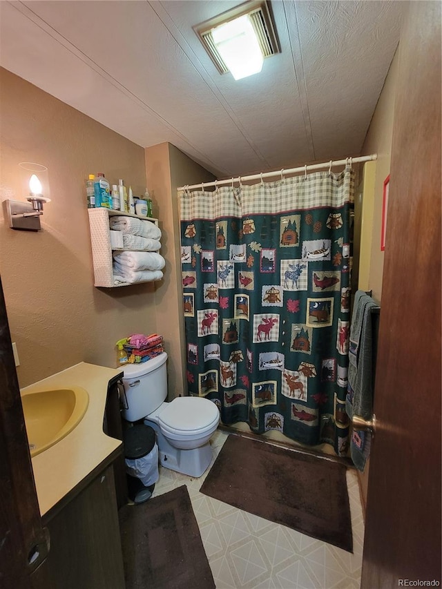 bathroom featuring vanity, visible vents, a textured ceiling, curtained shower, and toilet