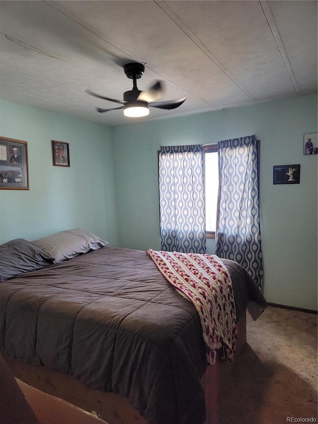 carpeted bedroom with a ceiling fan