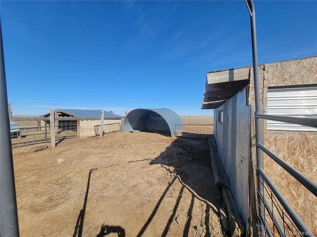 view of yard with an outdoor structure