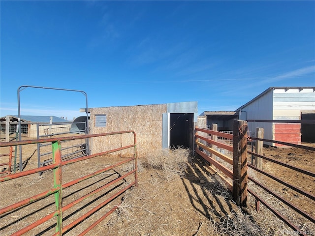 view of yard featuring an outbuilding and an exterior structure