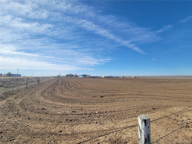 view of yard with a rural view