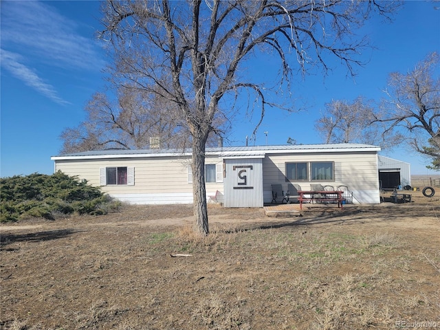 view of front of property with metal roof