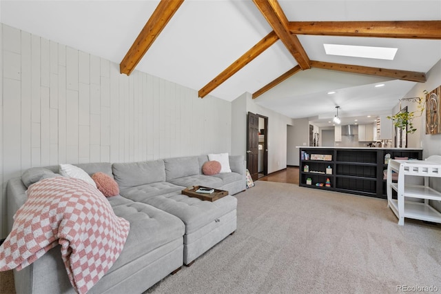 carpeted living area with recessed lighting, wood walls, and lofted ceiling with skylight