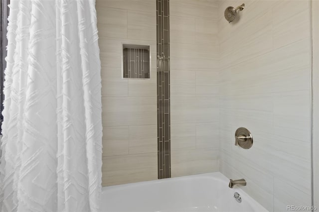 full bath featuring shower / tub combo with curtain