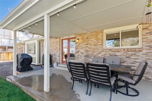 view of patio / terrace featuring french doors, fence, and grilling area