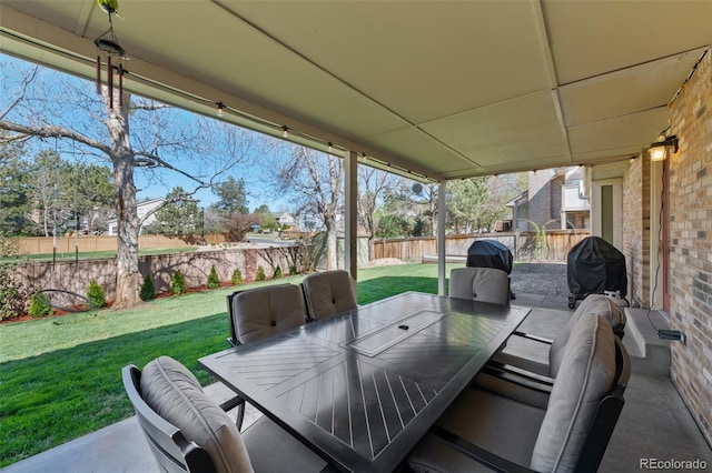view of patio / terrace featuring outdoor dining area and a fenced backyard