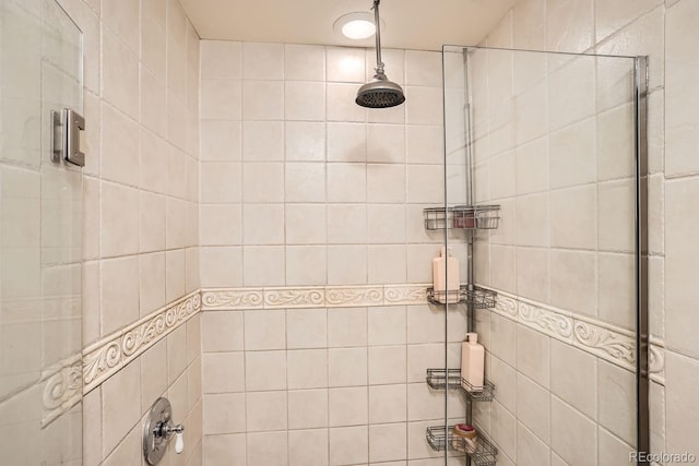 bathroom with tiled shower