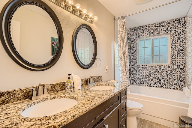 full bathroom with shower / bath combo, toilet, wood-type flooring, and vanity