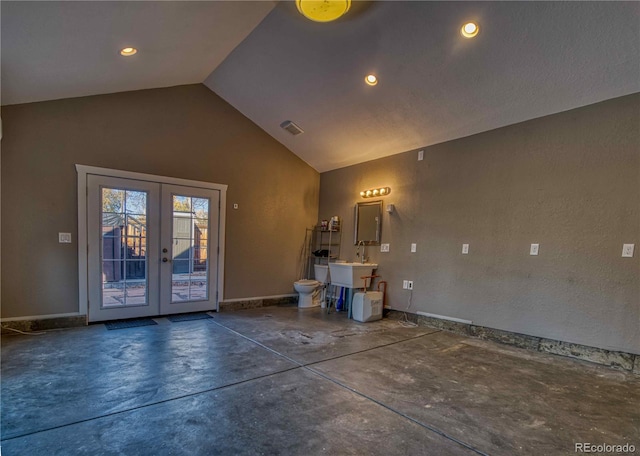 interior space featuring french doors and vaulted ceiling