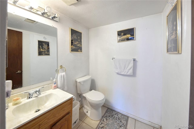 bathroom with toilet, visible vents, tile patterned flooring, and vanity