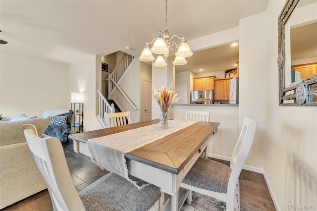 dining room with a chandelier and dark hardwood / wood-style flooring