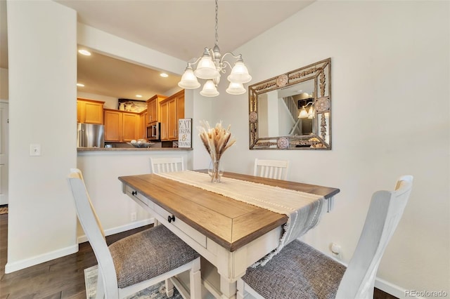 dining room with dark hardwood / wood-style floors