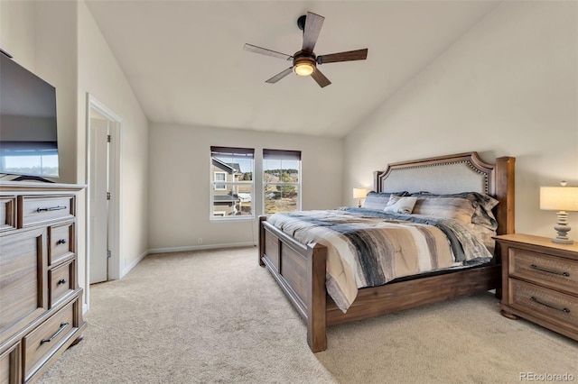 carpeted bedroom with ceiling fan and lofted ceiling