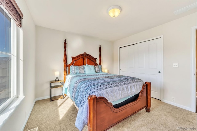 carpeted bedroom featuring a closet