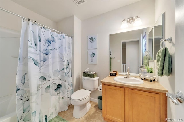 full bathroom featuring vanity, tile patterned floors, shower / bath combo with shower curtain, and toilet