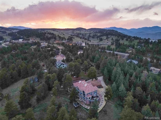 aerial view at dusk with a mountain view