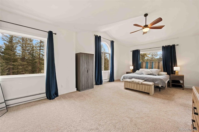 bedroom with multiple windows, light colored carpet, and lofted ceiling