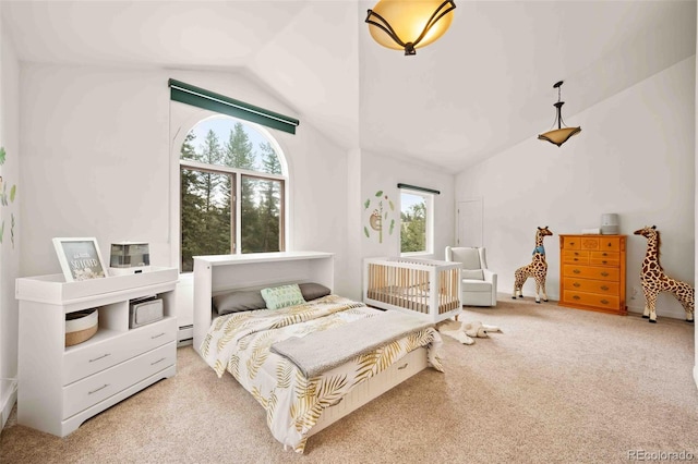 bedroom featuring carpet floors, baseboard heating, and high vaulted ceiling