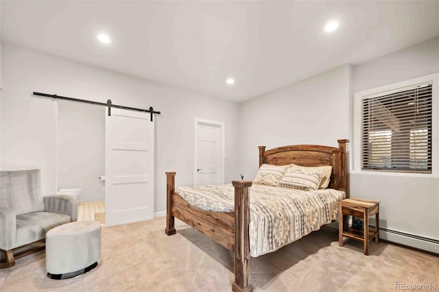 bedroom with recessed lighting, a barn door, baseboards, and light carpet