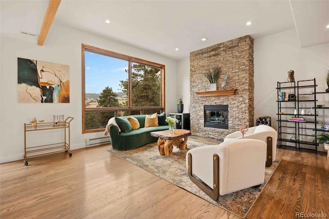 24140 US Highway 40, Golden, CO 80401 - living room featuring baseboard heating, wood finished floors, a fireplace, and recessed lighting