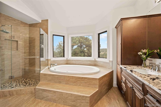 24140 US Highway 40, Golden, CO 80401 - full bathroom featuring a garden tub, vanity, and a shower stall