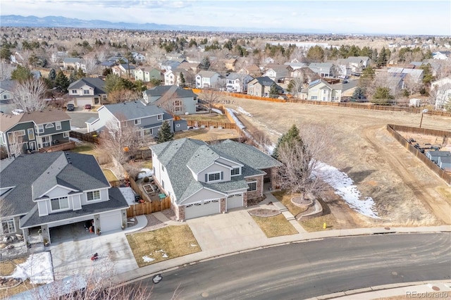 birds eye view of property with a mountain view