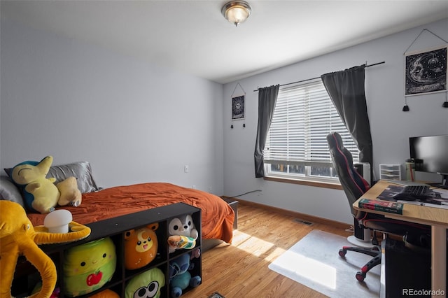 bedroom featuring light wood-type flooring