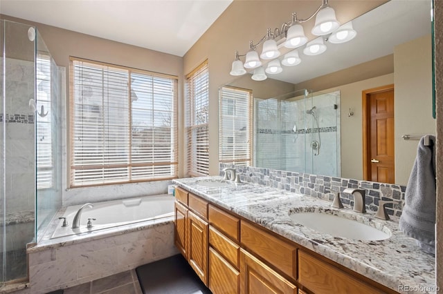 bathroom featuring shower with separate bathtub, plenty of natural light, vanity, and tile patterned floors