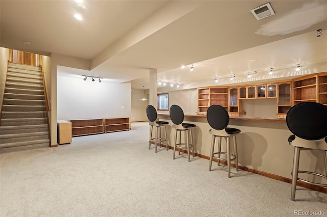 interior space featuring bar and rail lighting