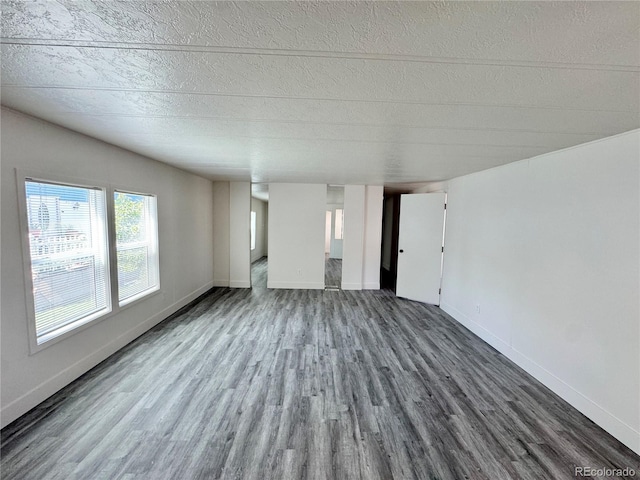 8480 Adams Way, Denver, CO 80229 - unfurnished living room featuring wood finished floors and a textured ceiling