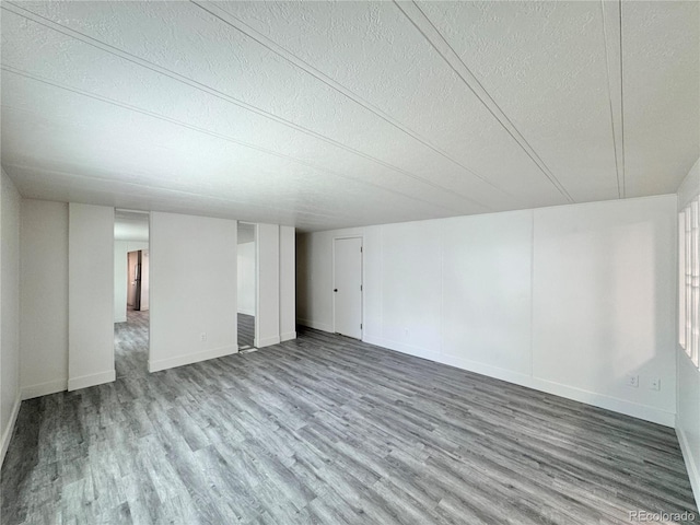 8480 Adams Way, Denver, CO 80229 - empty room with wood finished floors and a textured ceiling