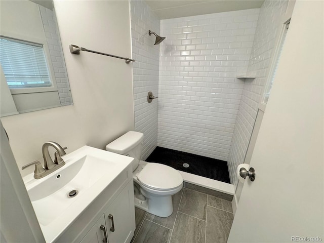 8480 Adams Way, Denver, CO 80229 - bathroom with a tile shower and vanity