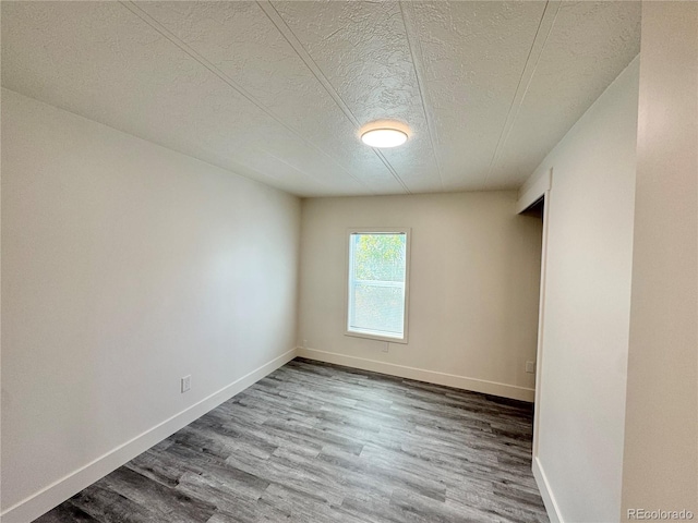8480 Adams Way, Denver, CO 80229 - spare room with a textured ceiling and wood finished floors