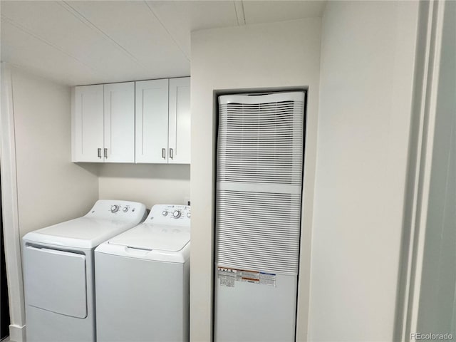 8480 Adams Way, Denver, CO 80229 - laundry area featuring a heating unit, cabinet space, and washing machine and clothes dryer