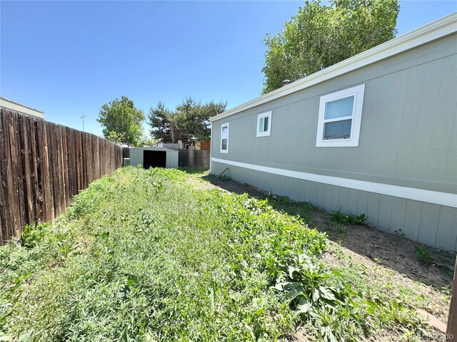 8480 Adams Way, Denver, CO 80229 - view of yard with a storage shed