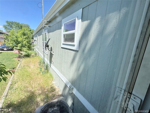 8480 Adams Way, Denver, CO 80229 - view of property exterior with a cooling unit and a lawn