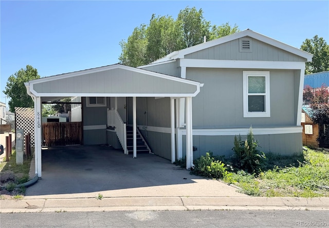 8480 Adams Way, Denver, CO 80229 - manufactured / mobile home featuring a carport